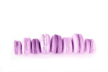 Wall Mural - French purple macaroons on white isolated background. Bold hues for seasonal projects and basis designs.