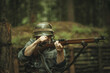 © Svetliy - A soldier of the Finnish army during World War II, shoots a rifle in the forest.