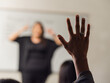 © INDÍGENA - Closeup of a student raising their hand