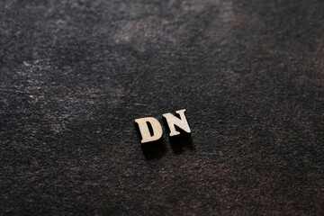 Wall Mural - The letters D and N above the dark field. Initials DN