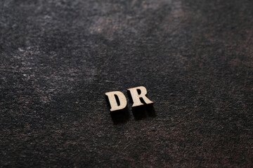 Wall Mural - The letters D and R above the dark field. Initials DR