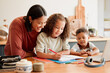 © Kay Abrahams/peopleimages.com - Mother teaching, learning and education with child studying, doing homework or writing in book during an at home lesson or homeschooling. Daughter in early childhood development enjoying fun activity