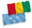 Flags of Federated States of Micronesia and Guinea on a white background