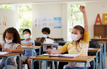 Poster - Wearing face mask to protect from covid while learning in class, answering education question and studying with students in a classroom. Girl sitting at a desk and raising hand during a pandemic