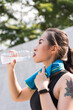 © Allen Chen - Asian woman drinking water after exercise