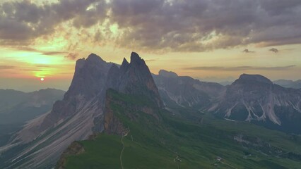 Wall Mural - View from above, stunning aerial view of the mountain range of Seceda during a beautiful sunrise. The Seceda with its 2.500 meters is the highest vantage point in Val Gardena, Dolomites, Italy