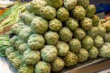 Fototapeta Kuchnia - Fresh green artichokes vegetables on farmers market in Spain