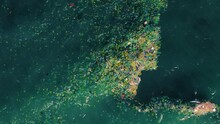 Aerial View Of Plastic Bag Trash Polluted Ocean Water, Zoom In Pollution Toxic Waste Rubbish Garbage 