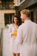© BGStock72 - Young couple relaxing on  the outdoor terrace and drinking fresh orange juice