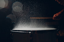Close Up Drum Sticks Drumming Hit Beat Rhythm On Drum Surface With Splash Water Drops