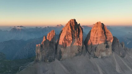 Wall Mural - View from above, stunning aerial view of the Three Peaks of Lavaredo (Tre cime di Lavaredo) during a beautiful sunrise. The Three Peaks of Lavaredo are the undisputed symbol of the Dolomites, Italy.