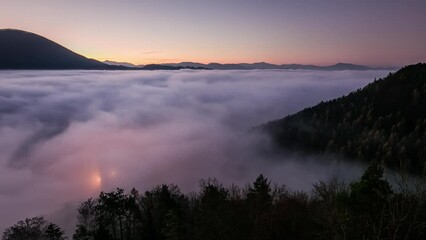 Canvas Print - time lapse at night over clouds with forest and mountain