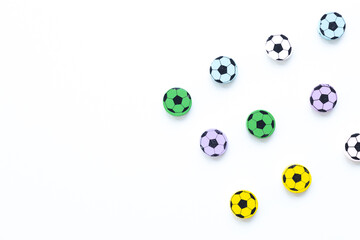 Wall Mural - Wooden figures in the form of soccer balls on a white background