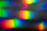 Fototapeta Tęcza - Blur colorful rainbow crystal light leaks on black background. Defocused abstract multicolored retro film lens flare bokeh analog photo overlay or screen filter effect. Glow Vintage prism colors