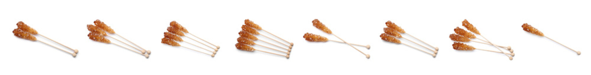 Wall Mural - Set of wooden sticks with sugar crystals on white background, banner design. Tasty rock candies