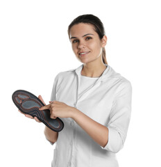 Sticker - Beautiful female orthopedist showing insole on white background