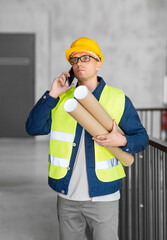 Wall Mural - architecture, construction business and people concept - male architect in helmet with blueprint calling on smartphone at office