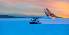 Hovercraft Rides On Lake Baikal Ice At Sunset - Ogoy Island On Winter Baikal Lake With Transparent Cracked Blue Ice At Sunrise - Baikal, Siberia, Russia