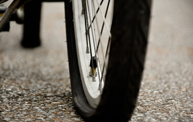 Wall Mural - Bike flat tire on pavement, soft and selective focus.