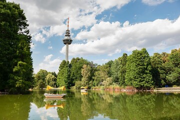 Sticker - Telecommunications Tower in the Luisenpark park in Mannheim, Germany, with a pond and trees