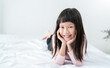 © paulaphoto - Portrait of young fun happy little cute asian girl relax in bed room with copy space. Education for toddler or preschool, childhood healthy lifestyle, back to school concept