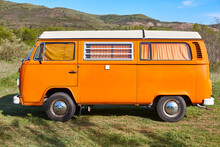 Vintage Camper Van Under A Blue Sky. Recreational Vehicle. Summertime