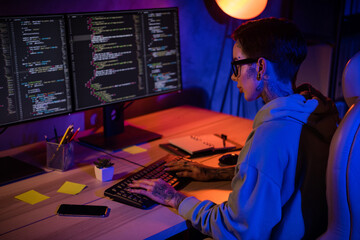 Profile portrait of experienced intelligent programmer girl sitting chair keyboard typing code workplace indoors