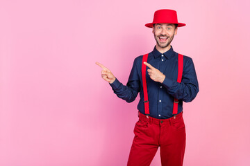 Sticker - Photo of cheerful excited person indicate fingers empty space proposition isolated on pink color background