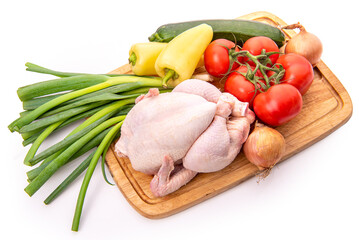 Sticker - Raw chicken and vegetables on a cutting board