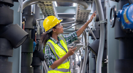 Engineer checking the cooling system of the factory air conditioner.