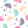 Seamless pattern with colored umbrellas and drops.