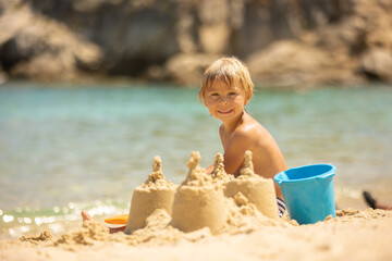 Sticker - Happy child on the beach, enjoying summer, playing