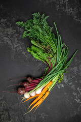 Wall Mural - Bunch of fresh organic beetroots and carrots with green leaves. onion garlic heads, The concept of agriculture and gardening, growing and caring for vegetables. top view