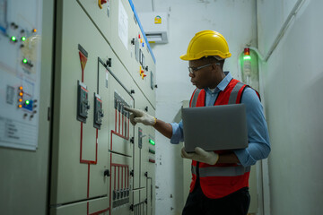 Aufkleber - Engineer working in electrical room with power energy motor machinery cabinets with panel in control or server room.