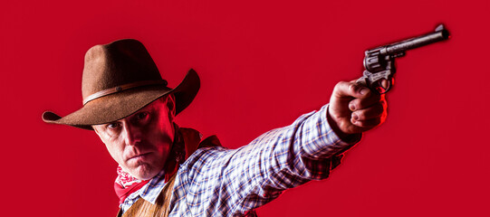 American bandit in mask, western man with hat. West, guns. Portrait of a cowboy. owboy with weapon on red background