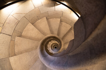 Top view of the spiral staircase in the tower. Walking down old the winding stairs