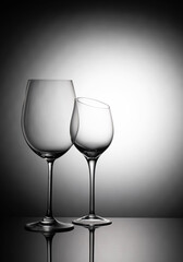 Two glass goblets on a gradient background