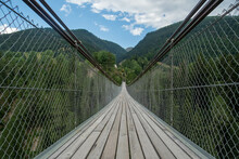 Suspension Bridge In Muhlebach, Over The Rhone River