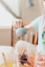 Close Up Of Young Girl Dying An Easter Egg Pink And Blue
