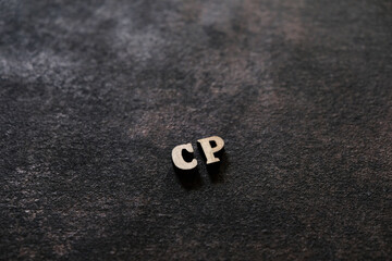 Wall Mural - The letters C and P above the dark field. Initials CP