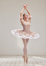 Female Ballerina Doing Ballet Dance, Dancing Or Performing During A Practice Rehearsal In Studio. Young Dancer Or Artist In A Tutu Costume Dress And Shoes Doing Pointe Technique On Toes Performance
