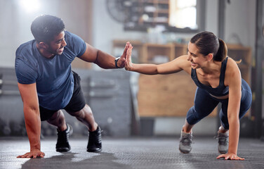 Poster - Fitness, motivation and high five while doing push ups and exercising together at the gym. Healthy, fit and athletic couple goals while enjoying a training session with teamwork at a health club