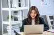 © todja - Portrait of Asian beautiful business woman working at the office, using computer. buiness concept.