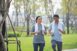 © Suriyo - Asian people older couple retirement workout in city park