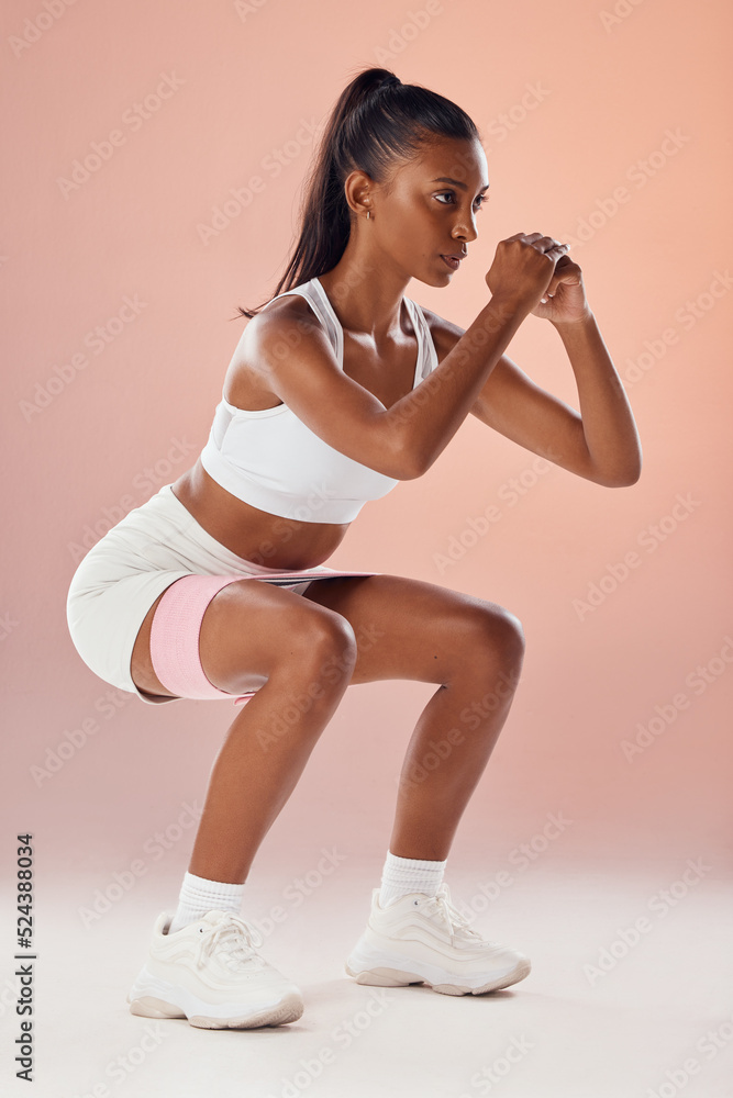 Photo Stock Squat exercise and fit female athlete in a training workout for glutes buttocks and muscle in a studio. Woman in fitness exercises squatting for a strong core for a healthy