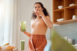 © K Abrahams/peopleimages.com - Eating, tasting and drinking a green health smoothie with a young female in a kitchen. Woman on a weight loss, organic and fresh fruit and food diet for wellness, nutrition and a healthy lifestyle