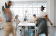 © Siphosethu Fanti/peopleimages.com - Blurred designers, marketing or freelance professionals working together in a modern office. Business men and women busy, walking and active in a creative workplace, workstation or environment
