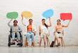 © Kay Abrahams/peopleimages.com - Social media, copy space and sign with a team of business women sitting in line and holding speech bubble for text or talking. Portrait of females advertising and marketing with blank and empty board