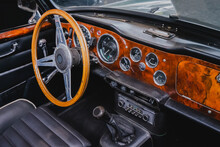 Interior Of A Retro Sports Car With Steering Wheel And Dashboard