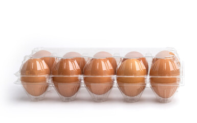 Eggs in a plastic box on the white background